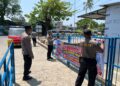 Waspada calo Pelabuhan Parepare, Polsek KPN memasang spanduk imbauan kepada penumpang di kawasan pelabuhan.